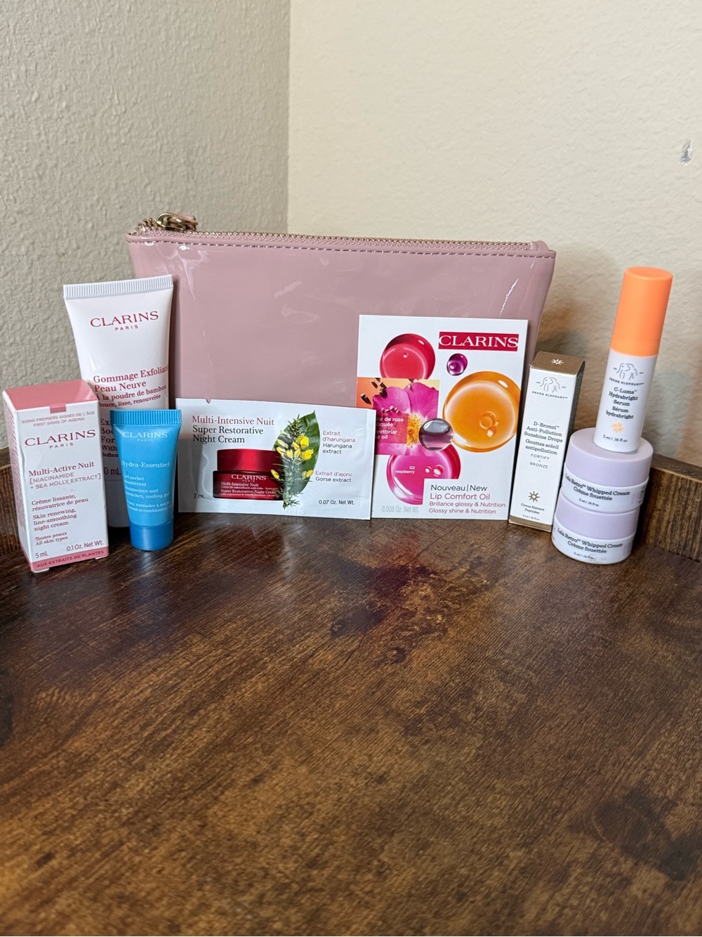 Juicy Couture Bag with Clarins and Drunk Elephant skincare bundle